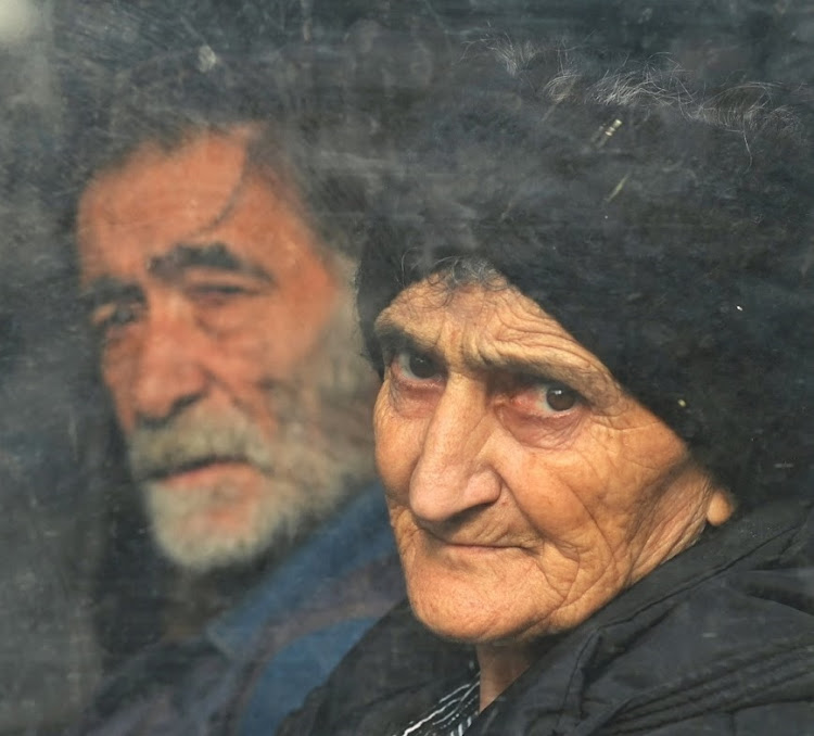 Residents sit inside a bus in central Stepanakert before leaving Nagorno-Karabakh, a region inhabited by ethnic Armenians, September 25 2023. Picture: DAVID GHAHRAMANYAN/REUTERS