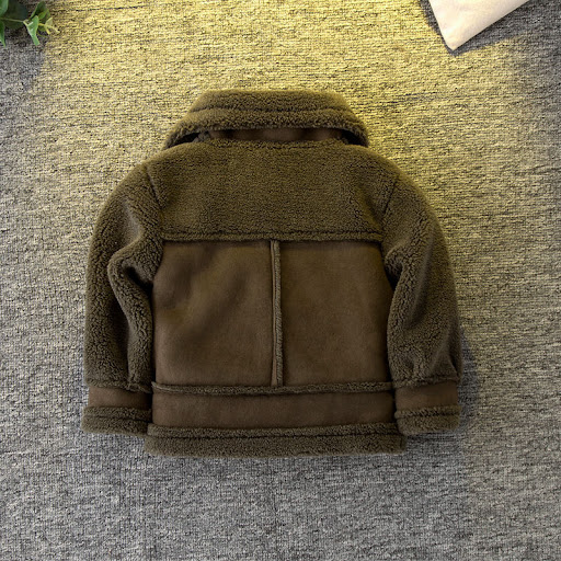 Title 7, Brown long-sleeved short jacket for children. P...