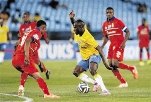 ESCAPE: Cuthbert Malajila of Sundowns dribbles past Grant Kekana and Ronald Kejijere of AmaTuks in their Telkom Knockout last 16 match