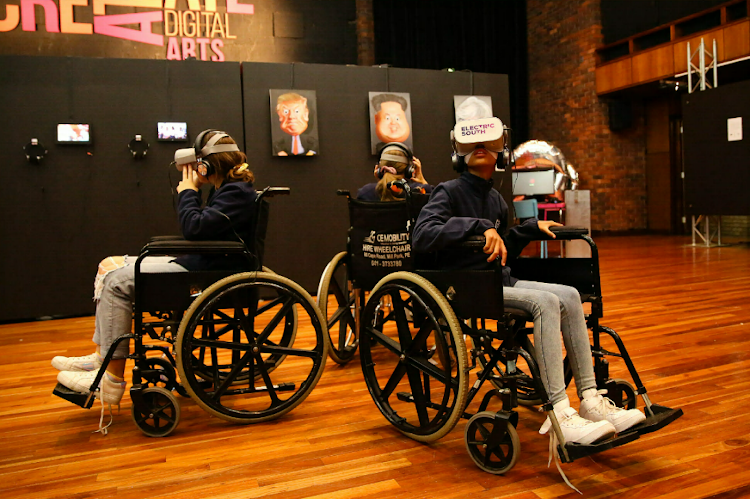 Pupils from Clarendon Primary School in East London at the virtual reality installation ‘Here’