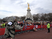 John Black run the London Marathon in a rhino suit. 