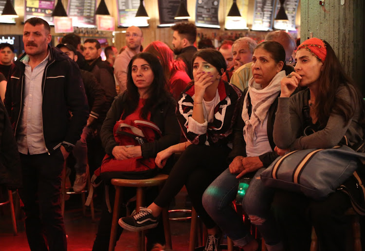 Local Turks react as preliminary Turkish national election results in Berlin, Germany, May 14 2023. Turkish citizens in Germany, home to the country's largest diaspora, turned out in record numbers to vote in elections. Picture: ADAM BERRY/GETTY IMAGES