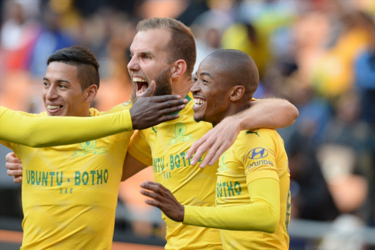 Jeremy Brockie (C) of Mamelodi Sundowns celebrates his first goal in Sundowns colors with teammates Gaston Sirino (L) and Thapelo Morena during the Shell Helix Ultra Cup match against Kaizer Chiefs at FNB Stadium on July 21, 2018 in Johannesburg, South Africa.