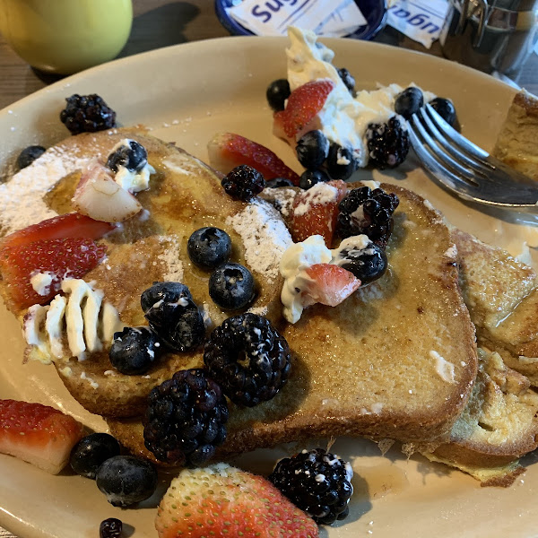 Gluten Free French Toast Neat. Pardon the half eaten slice, I was excited and forgot to take the picture first.  It was delicious.