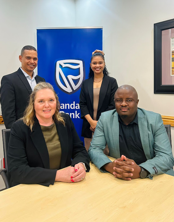 The entrepreneurship accelerator project was launched in 2022 and has already assisted 250 micro, small and medium enterprises. At the announcement were, front from left, Standard Bank’s Leigh-Anne De Witt (executive head of business clients coverage, Eastern Cape) and Lunga Mjodo (chamber business information manager), and, back from left, Jonty Bouw (Standard Bank’s head of enterprise banking, Eastern Cape) and Terri Diedericks (chamber entrepreneurship administrator)