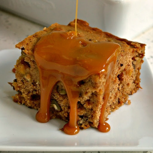 An easy family friendly scrumptiously moist applesauce spice cake with pecans and raisins. It is perfect for potlucks, family events, fall parties and festivals.