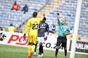 Victor Gomes shows a  red card to Elias Pelembe of Bidvest Wits in the cup match against Orlando Pirates./Gallo Images / Lefty Shivambu