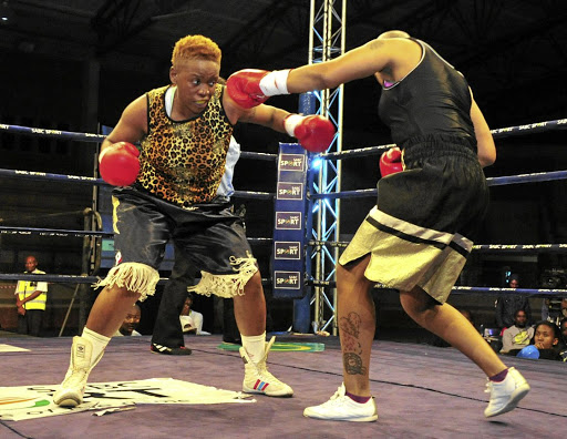 Mapule 'Thunder' Ngubane about to pounce on Julie Tshabalala during their recent welterweight fight in Polokwane. / Philip Maeta / Gallo Images