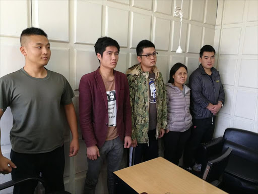 The five Chinese nationals arrested with military equipment at an apartment in Lavington, Nairobi on Friday, October 5, 2018. /COURTESY