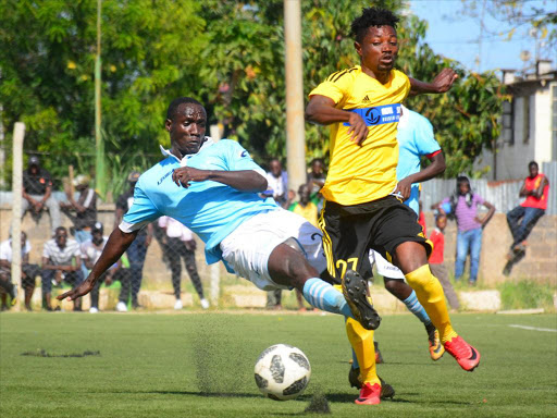 Kisumu All Stars’ Dan Odhiambo (L) tackles Paul Acqua of Wazito during a recent NSL encounter at Camp Toyoyo