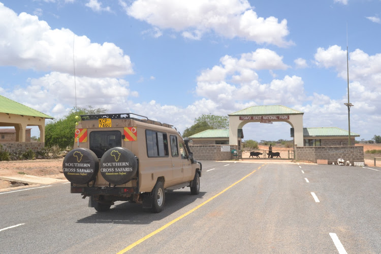 A tour van at the Sala Gate, the gateway to Tsavo East National Park.