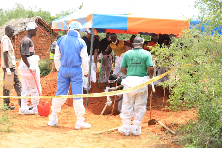 Detectives conducting exhumation of bodies in Shakahola forest.