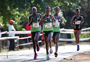 Winner Tadu Nare leads Nedbank teammates Helalia Johannes (left)  and Salem Gabre (right), with Boxer AC's Glenrose Xaba further back in the Johannesburg leg of the Spar Women’s 10km Grand Prix Series on October 2 2022.