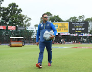 South Africa coach Mark Boucher leaves the field after inspecting the conditions as the toss is delayed during Day One of the Fourth Test between South Africa and England at The Wanderers on January 24, 2020 in Johannesburg, South Africa. 