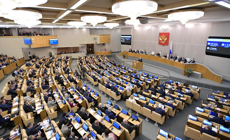 Russia's Prime Minister Mikhail Mishustin delivers a speech during a session of the State Duma, the lower house of parliament, in Moscow, Russia April 7, 2022.