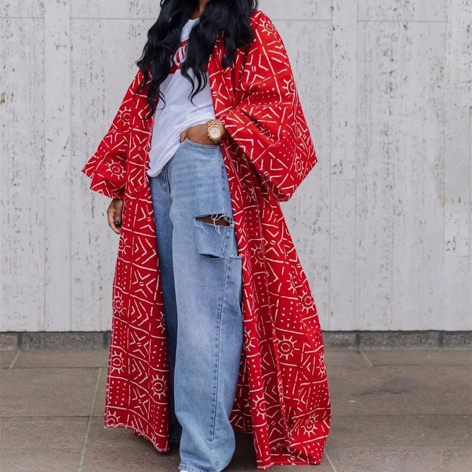 Cardigan long imprimé avec un style unique, idéal pour toutes les occasions. Rehaussez votre look avec ce vêtement tendance et flatteur, parfait pour votre tempérament.