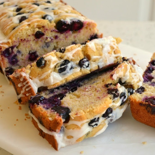 An easy sweet quick bread made with fresh lemon juice and plump blueberries all topped with a two ingredient lemon glaze.  Double the recipe and make an extra loaf for the family later in the week.