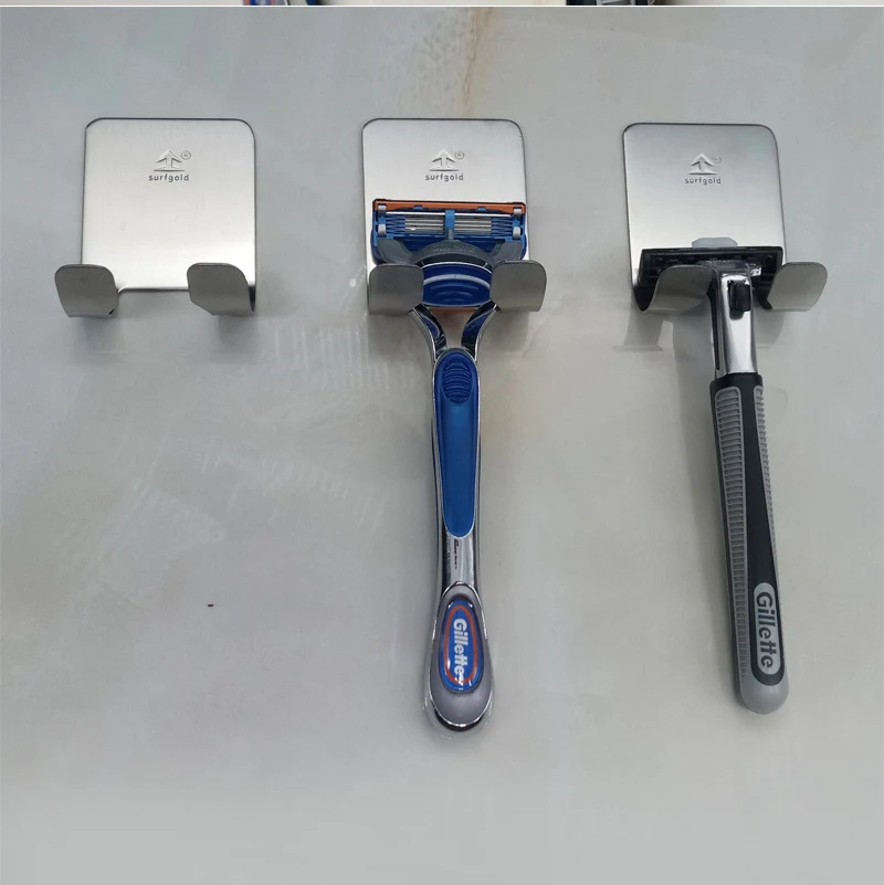 Suporte para barbeador de aço inoxidável para parede. Mantenha seu banheiro organizado, economize espaço e tenha seu barbeador sempre à mão. Durável e elegante.