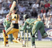 GREAT STRIDES: South Africa wicketkeeper Mark Boucher, right, attempts to run out Australia's Brad Haddin during the final ODI at the Wanderers stadium in Johannesburg on Friday. South Africa won the series 3-2. 17/04/09. Pic. Themba Hadebe. © AP.