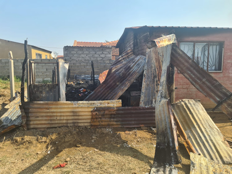 The fire-ravaged shack in which a four-year-old boy and his five-year-old sister perished with their 31-year-old mother in the early hours of Friday.