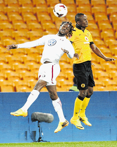 Siboniso Gaxa of Kaizer Chiefs, right, and Lerato Chabangu of Moroka Swallows battle it out during their teams' PSL encounter at FNB stadium last night