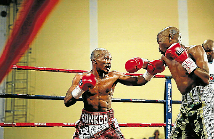 Simpiwe Konkco tries to break through Nkosinathi Joyi’s defences during the IBO mini-flyweight title clash. Konkco’s tactics eventually paid dividends.