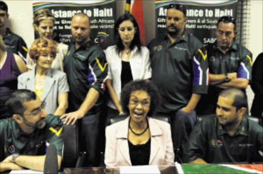 SAVIOURS: The Gift of the Givers search-and-rescue team addresses a press conference to welcome them back home from quake-ravaged Haiti. North West Premier Maureen Modiselle (with glasses) was present to congratulate the team on a job well done. Pic: PETER MOGAKI. 25/01/2010. © Sowetan.