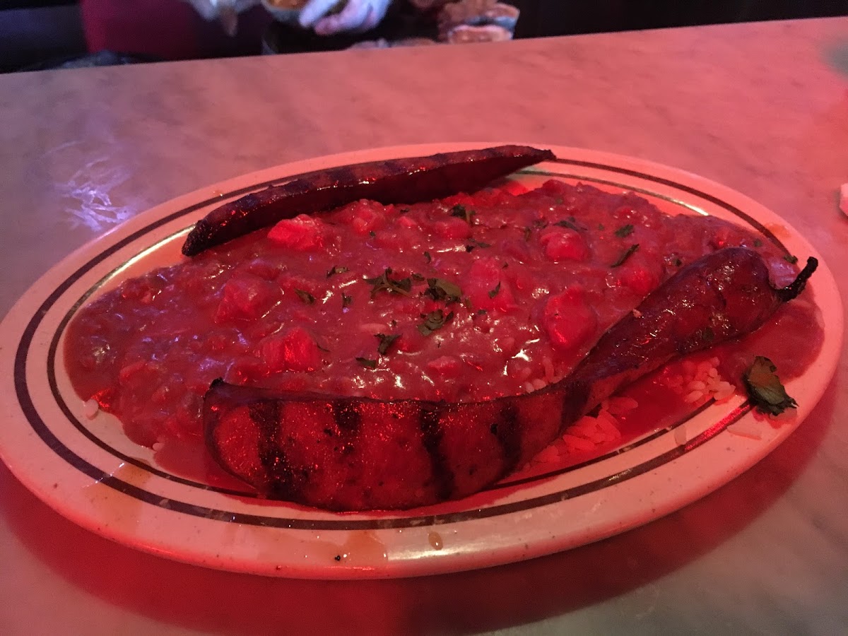 Red beans and rice with sausage. Rice was under cooked