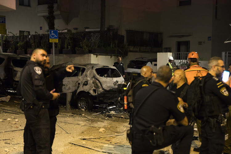 Israeli security forces stand near the site of a rocket strike from Gaza in Tel Aviv, October 7 2023. Picture: AMIR LEVY/GETTY IMAGES