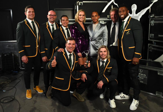 Formula One champion Lewis Hamilton posing with Springbok team members at the Laureus World Sports Awards in Berlin.