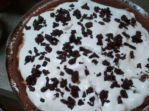 Easy Pumpkin Pie topped with Sugar Free Cool Whip & Chocolate Shavings.