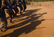 Ndebele initiates singing as part of the ritual during their home coming celebrations on July 10, 2013 at Wolwenkop in Mpumalanga.