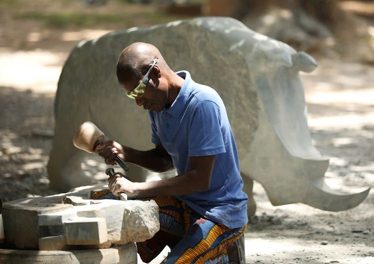 Zimbabwean sculptor Dominic Benhura. Picture: REUTERS/PHILIMON BULAWAYO