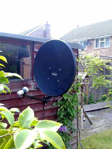 Freesat dish on the side of a shed