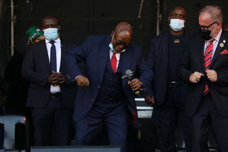 Former president Jacob Zuma performs his trademark dance moves at a gathering at Freedom Park near the Pietermaritzburg high court on Wednesday.