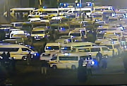 Taxis blockade the area around the Toyota factory, at Prospecton, south of Durban, as they protest over Quantum price increases.