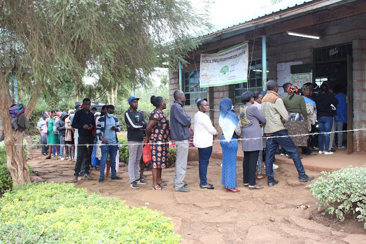 Voters queue at Kimorori Primary School in Maragua constituency on August 9, 2022.