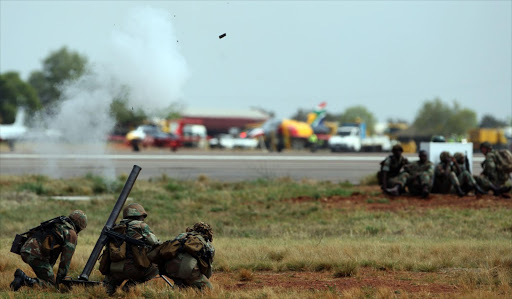 South African National Defence Force members fire a mortar round during a display for spectators at the Waterkloof Air Show in Pretoria. Pic: KEVIN SUTHERLAND. 22/09/2012. © Sunday Times