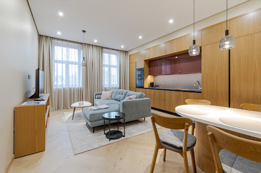 Modern living room with open kitchen and dining area in this luxury property for sale in Riga ($393,674 - 75 m²)