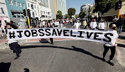 Chefs, waiters, winery workers, hoteliers & tourism operators protest for #JobsSaveLives in Cape Town’s CBD. Many in the industry lost their jobs and income due to the lockdown and curfew regulations. July 2, 2020. 