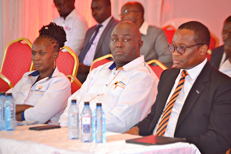 Univision Sacco CEC Florence Mutua, the Sacco's Chairman Rev. Augustus Munuve and a director with the Co-op Bank Vincent Marangu during the Thursday official rebranding and launch of strategic plan.