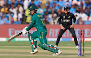 South Africa's Quinton de Kock plays a shot in the ICC Cricket World Cup match against New Zealand at MCA International Stadium in Pune, India, on November 1 2023.