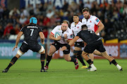 PJ Botha of Lions is tackled by Scott Baldwin of the Ospreys in the United Rugby Championship match at Swansea.com Stadium in Swansea, Wales on September 24 2022.