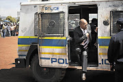 Police Minister Nathi Mthethwa leaving a police Nyala to speak to the people of Ratanda, south of Heidelberg, yesterday