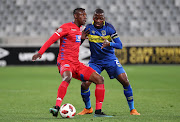 Evans Rusike of Supersport United challenged by Thamsanqa Mkhize of Cape Town City FC during the Absa Premiership 2018/19 football match between Cape Town City FC and SuperSport United at Cape Town Stadium, Cape Town on 4 August 2018.