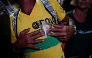 A man shows an image of late Cuban President Fidel Castro during a protest against the lack of electricity (not pictured) in the aftermath of Hurricane Ian in Havana, Cuba, on October 1, 2022. 
