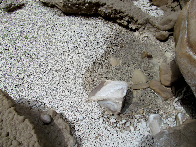 Sand and gravel covered in minerals