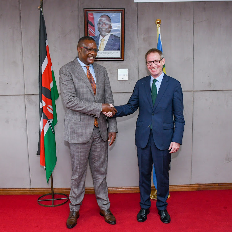Cabinet Secretary for Information, Communications and the Digital Economy Eliud Owalo together with UK Ambassador to Kenya, Neil Wigan pose for a photo during a formal meeting on May 20, 2024.