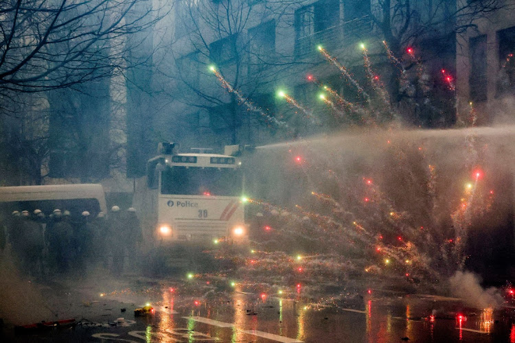 Police use a water cannon during a protest of European farmers in Brussels, Belgium, February 26 2024. Picture: YVES HERMAN/REUTERS