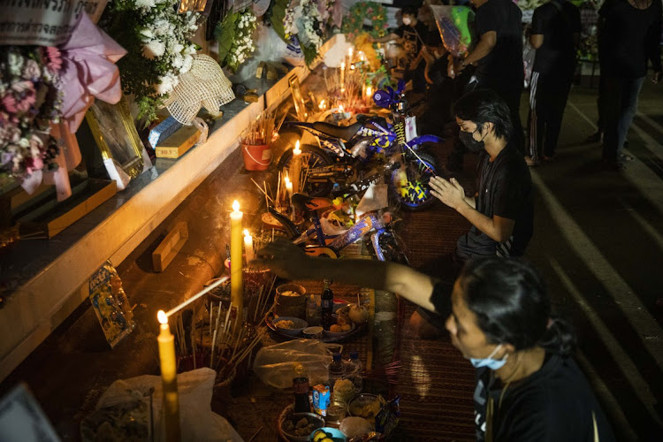 The relatives of victims gather at Wat Rat Samakee to pray in Uthai Sawan subdistrict, Nong Bua Lamphu, Thailand, October 9 2022. Picture: LAUREN DECICCA/GETTY IMAGES